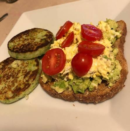 Avocado toast topped with organic eggs